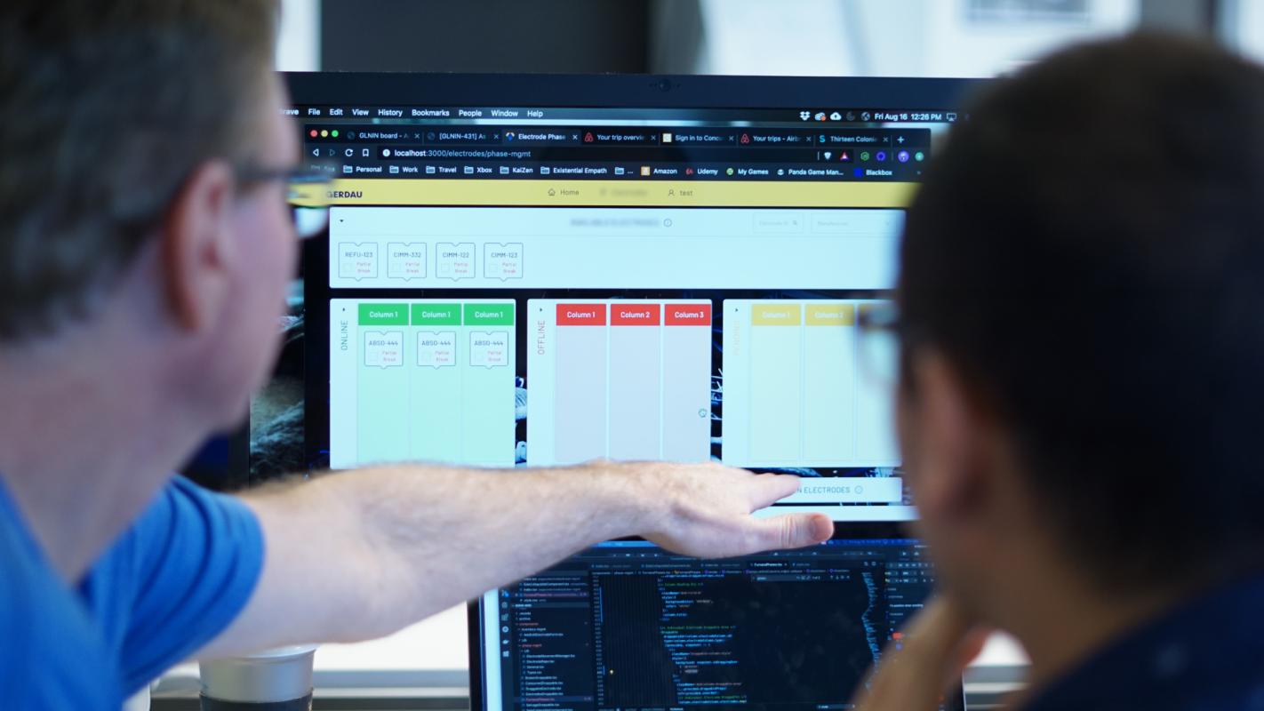 Iizuka works on making operations more efficient with the help of Scrum Master Jim Foster.